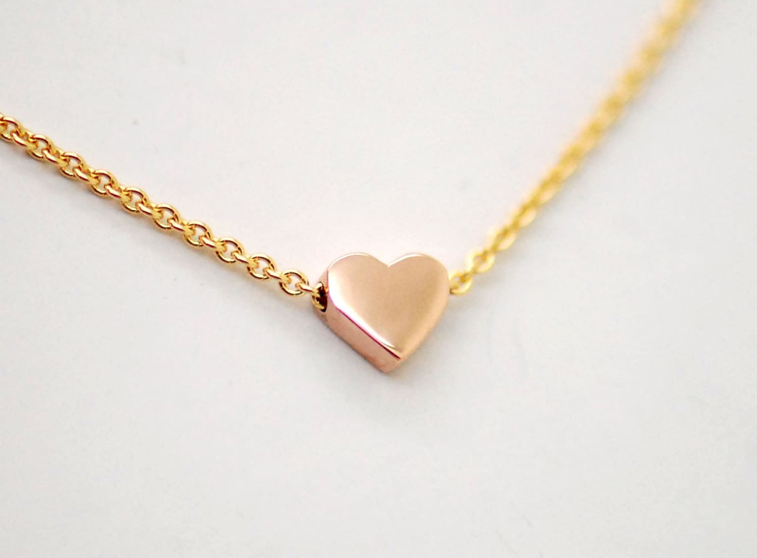 14K tiny rose gold heart on yellow gold chain