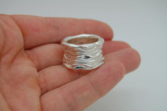 Wave Ring: Sterling Silver Wide Ring with three blue sapphires - Fine Jewelry by Anastasia Savenko